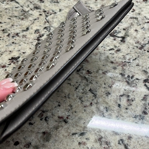 Michael Kors Authentic Silver Studded Wristlet. COA INCLUDED.